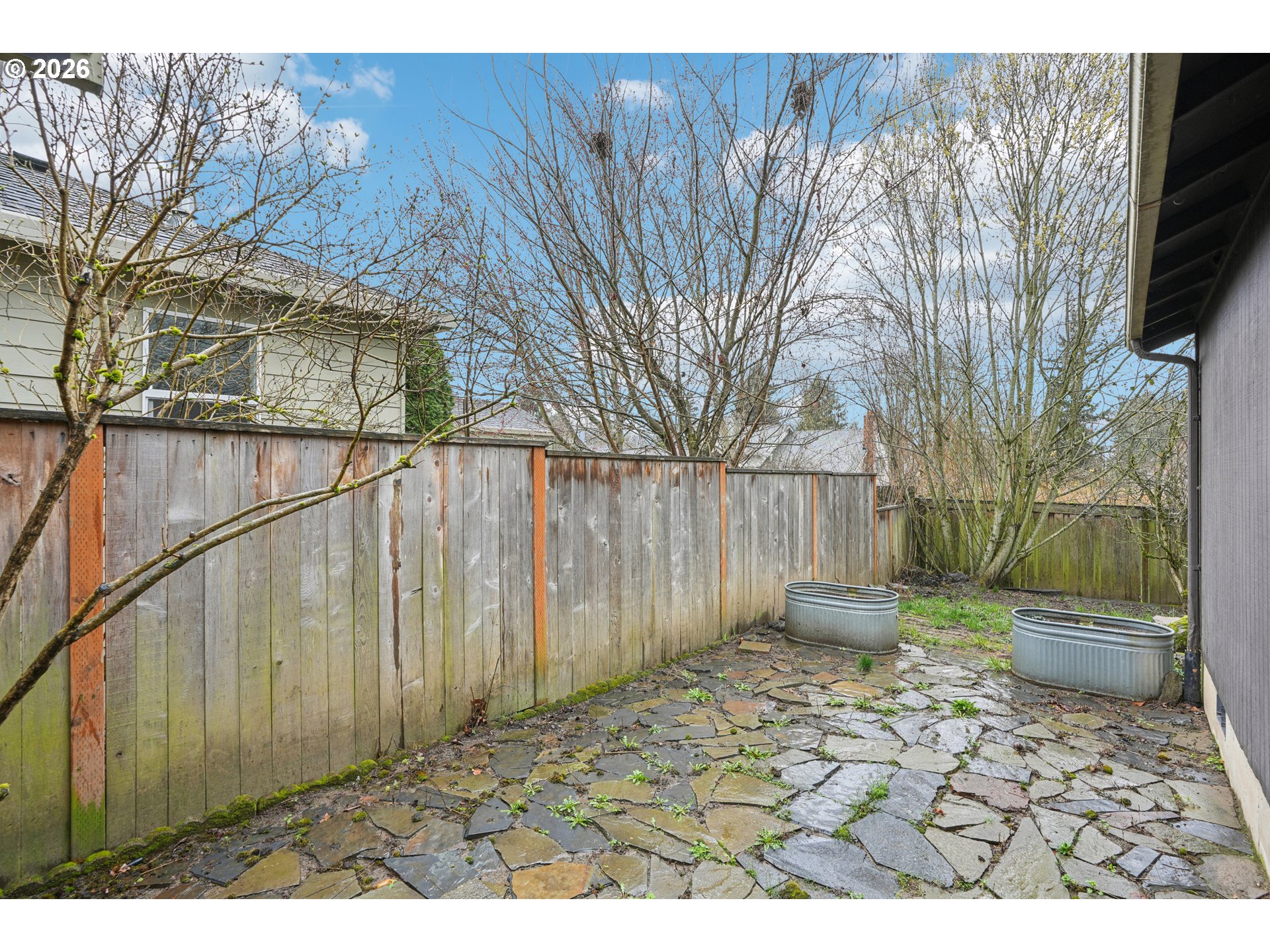 4133 Southeast Tibbetts Street Portland, OR 97202 - Photo 30 of 35 a backyard of a house with lots of green space