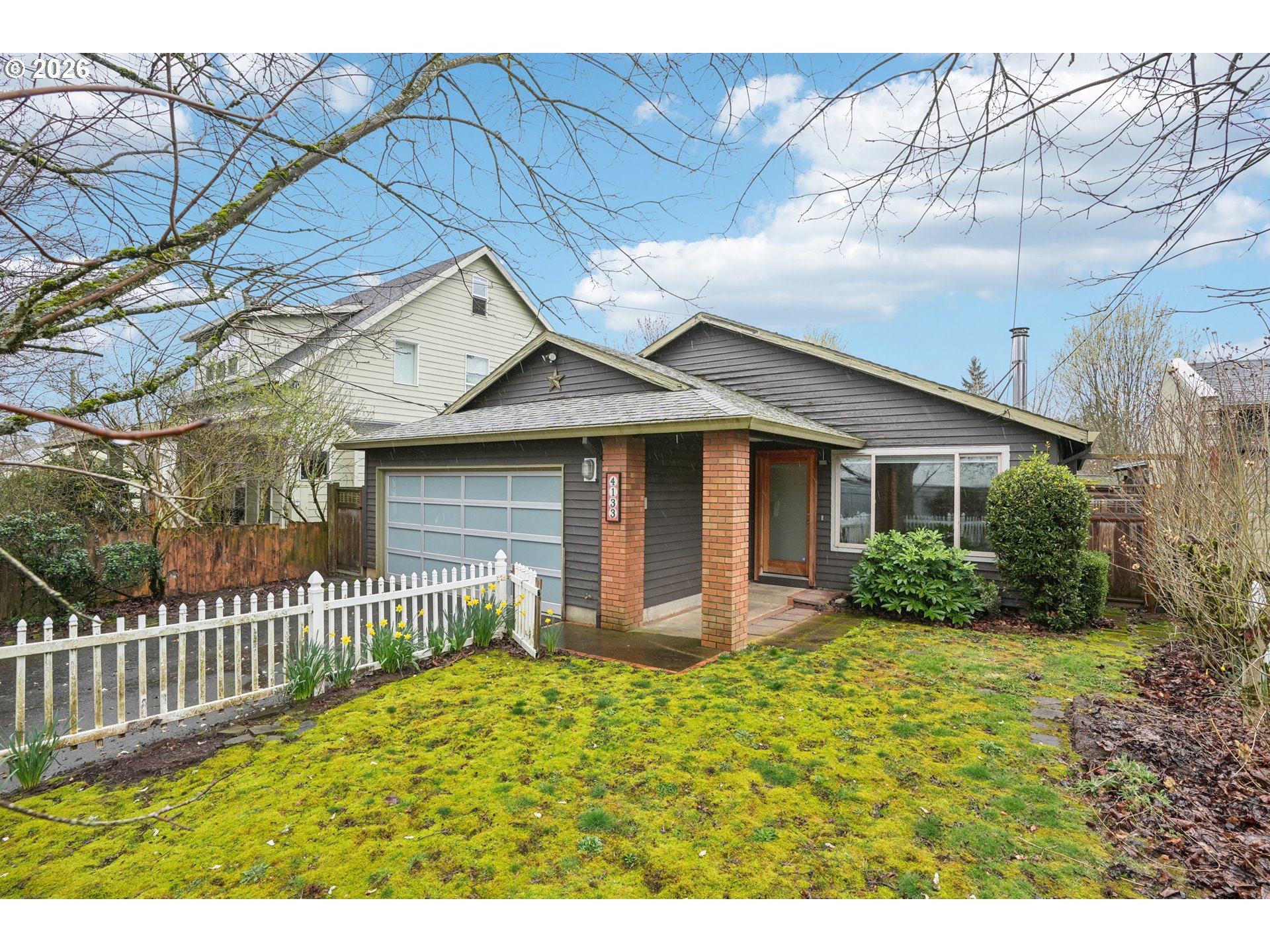 4133 Southeast Tibbetts Street Portland, OR 97202 - Photo 3 of 35 a front view of a house with garden