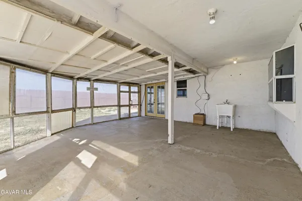 a view of an empty room with a balcony