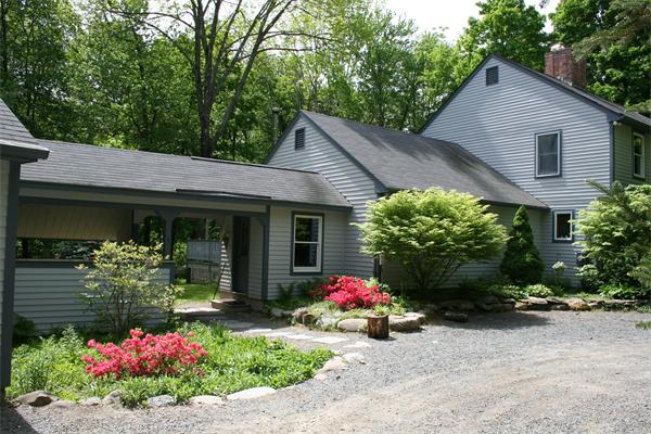 307 Shutesbury Road Amherst, MA 01002 - Photo 3 of 30 a front view of a house with a yard