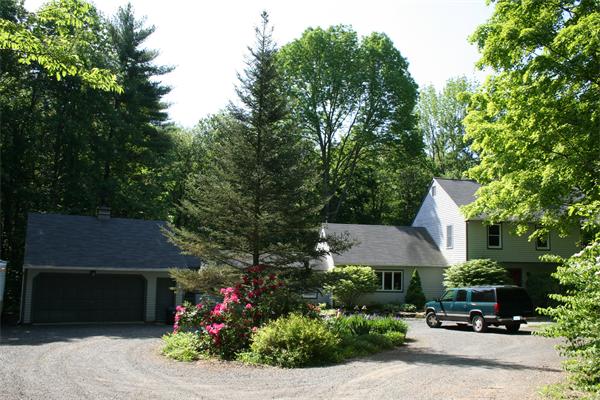307 Shutesbury Road Amherst, MA 01002 - Photo 5 of 30 a front view of a house with a yard and outdoor seating