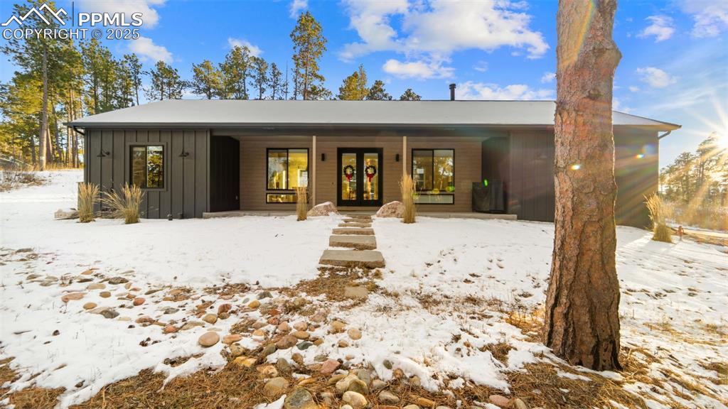 13455 Ravine Drive West Colorado Springs, CO 80908 - Photo 1 of 32 a front view of a house
