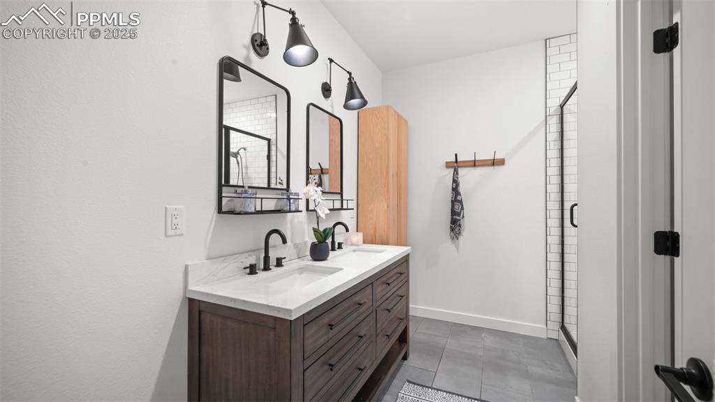 13455 Ravine Drive West Colorado Springs, CO 80908 - Photo 14 of 32 a bathroom with a sink and a mirror