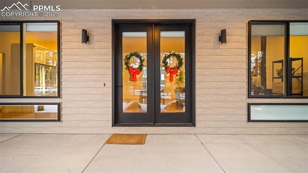 13455 Ravine Drive West Colorado Springs, CO 80908 - Photo 2 of 32 a view of front door of house with a bench