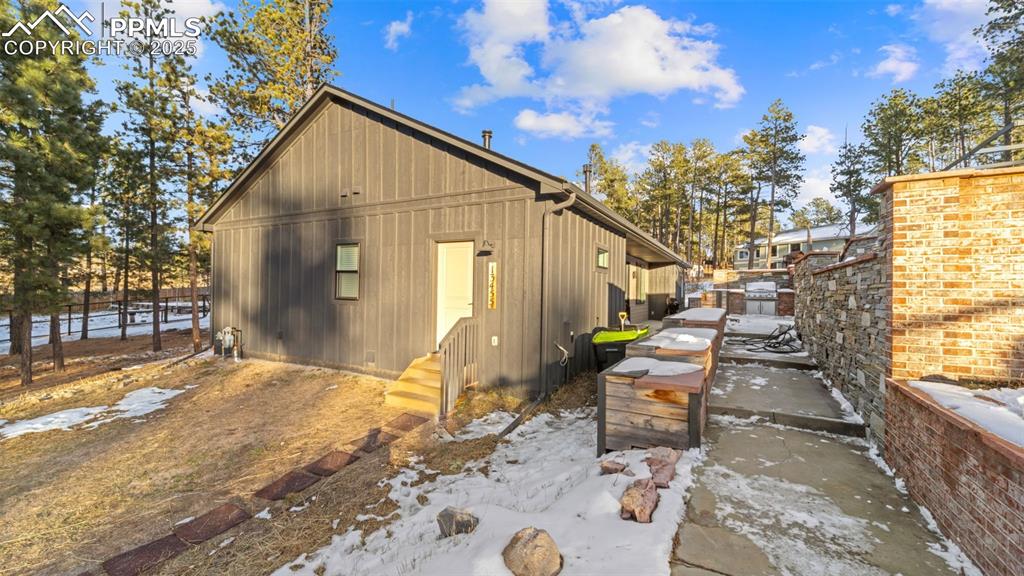 13455 Ravine Drive West Colorado Springs, CO 80908 - Photo 22 of 32 a backyard of a house with outdoor seating