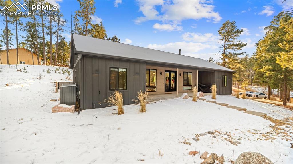 13455 Ravine Drive West Colorado Springs, CO 80908 - Photo 29 of 32 a view of a house with a patio