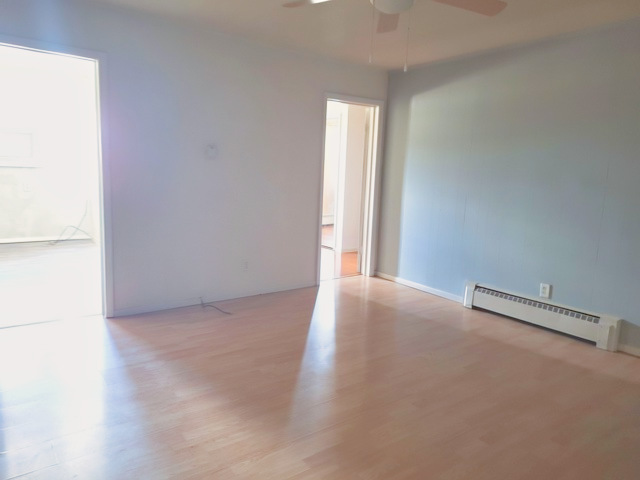 506 Main Street, Unit 2 Marseilles, IL 61341 - Photo 4 of 9 an empty room with windows