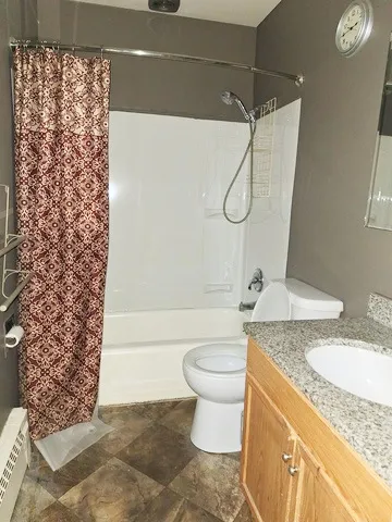 an empty room with wooden floor and door