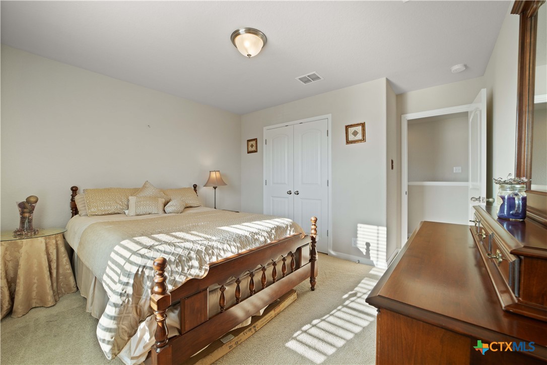 232 Albarella Cibolo, TX 78108 - Photo 35 of 42 a bedroom with a bed and a couch