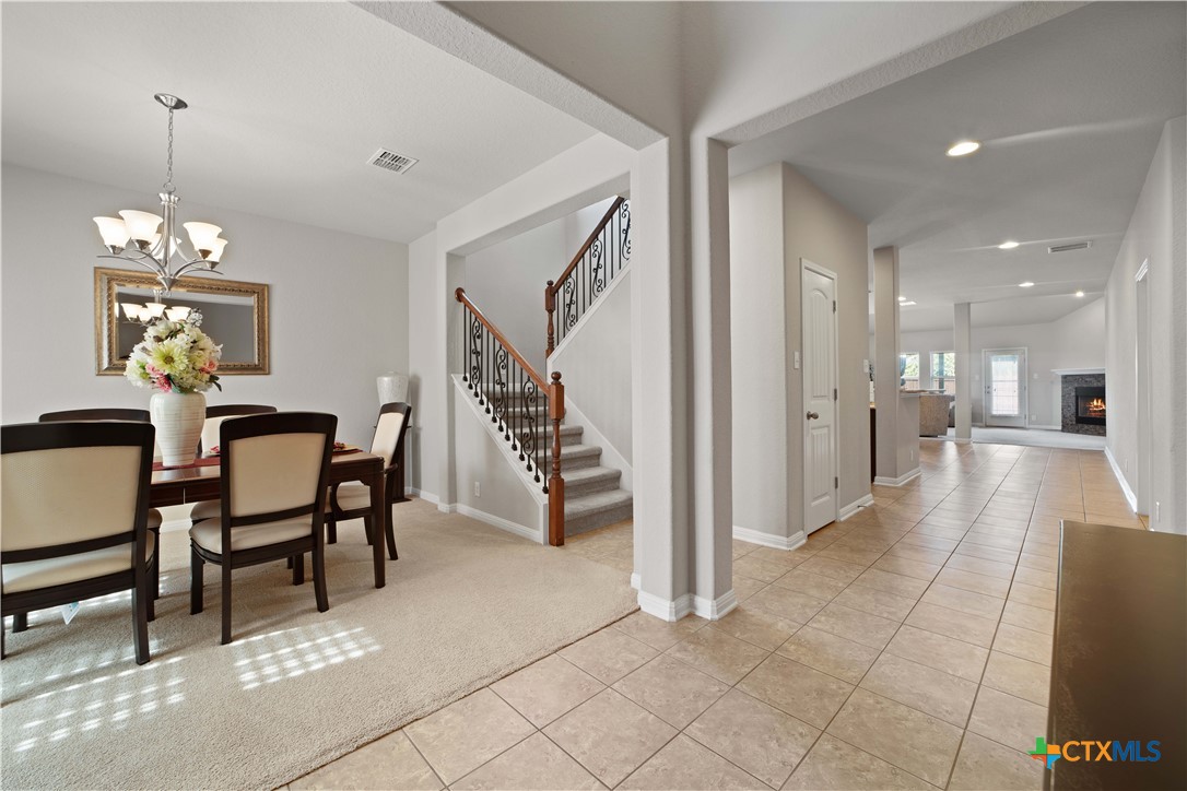 232 Albarella Cibolo, TX 78108 - Photo 4 of 42 a view of a dining room with furniture and a chandelier