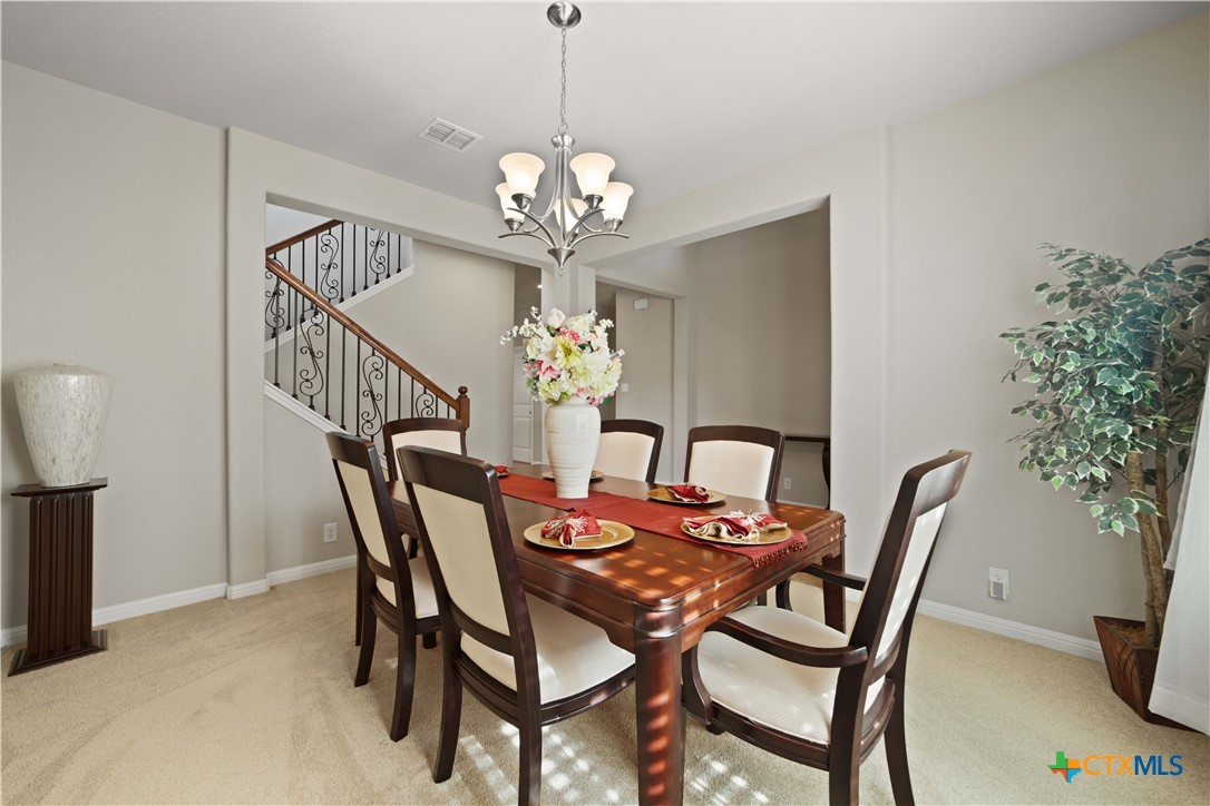 232 Albarella Cibolo, TX 78108 - Photo 7 of 42 a view of a dining room with furniture and chandelier