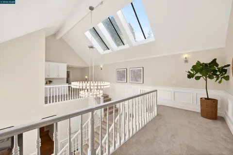 a utility room with cabinets washer and dryer