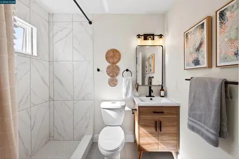 a kitchen with refrigerator a sink and cabinets