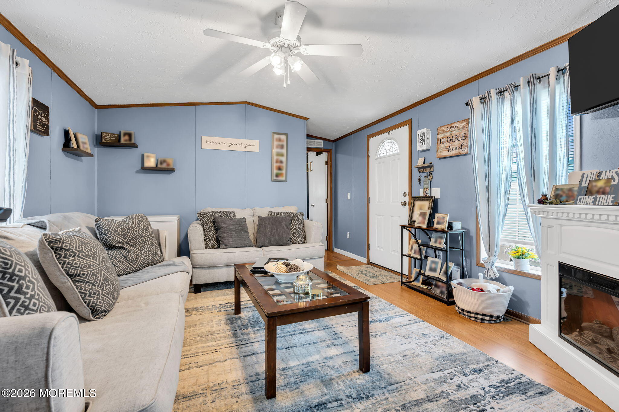 12 Locust Grove Hazlet, NJ 07730 - Photo 2 of 14 a living room with furniture and a fireplace