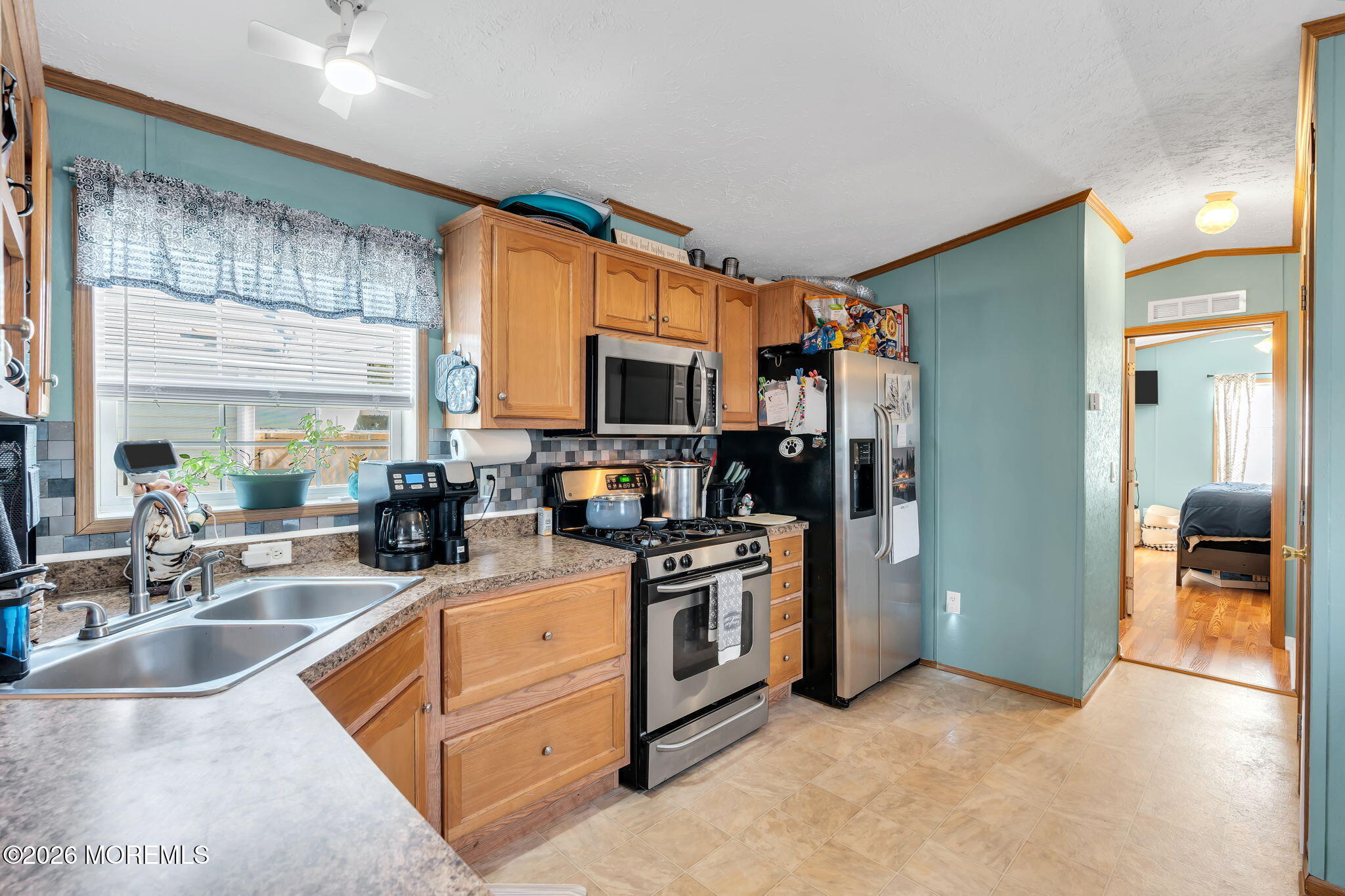 12 Locust Grove Hazlet, NJ 07730 - Photo 4 of 14 a kitchen with stainless steel appliances granite countertop a sink a stove and a refrigerator