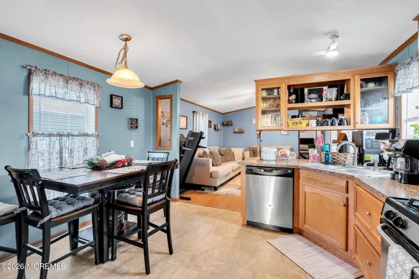 a kitchen that has a table and chairs in it