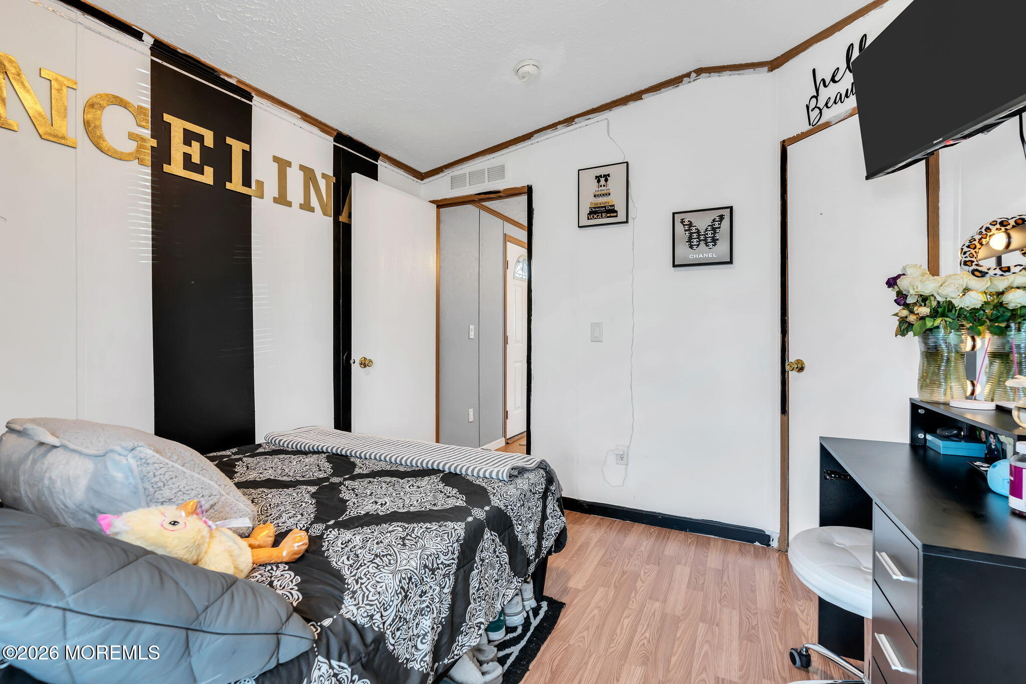 12 Locust Grove Hazlet, NJ 07730 - Photo 9 of 14 a bed room with a bed and a television