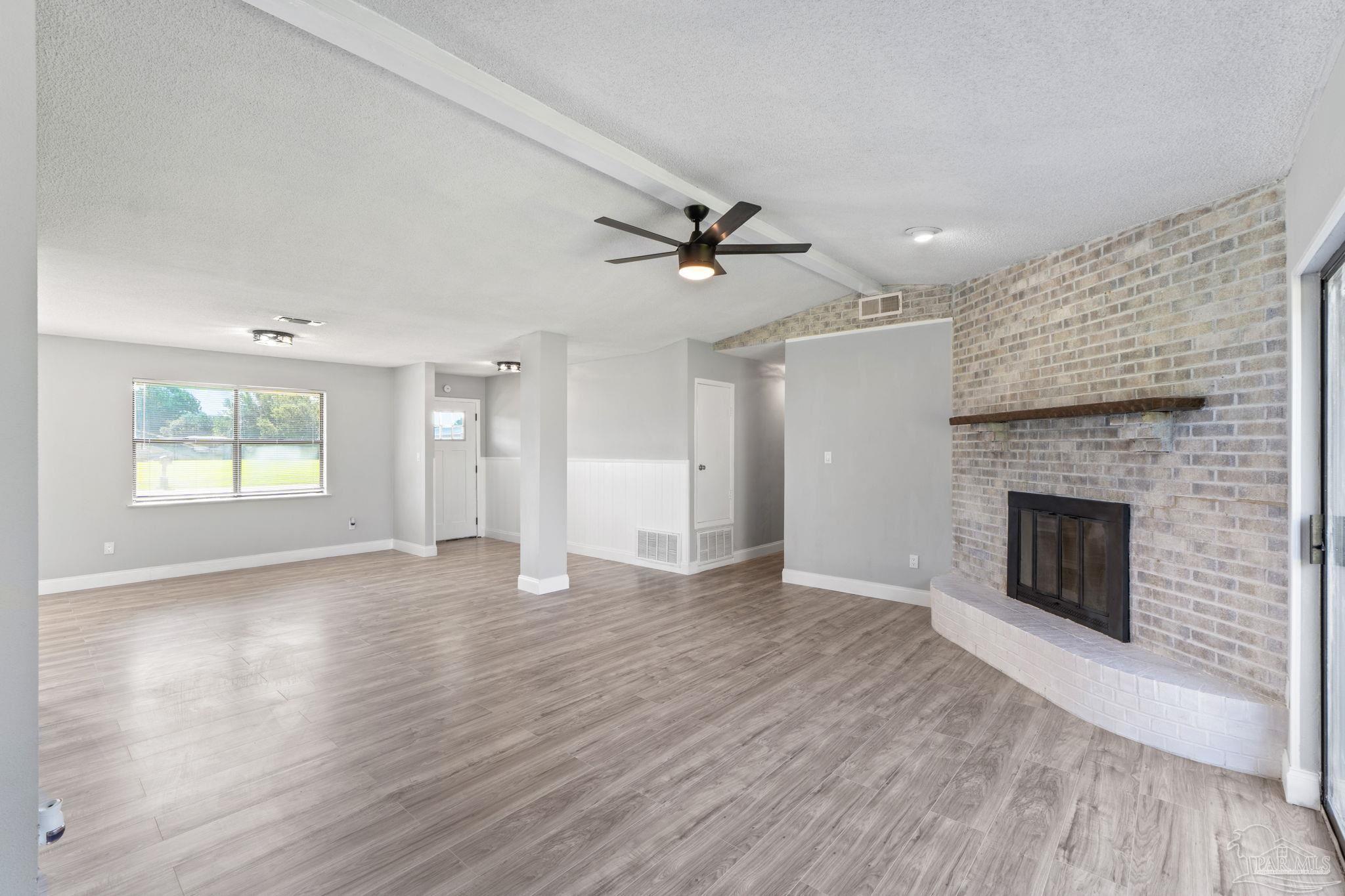 2501 Argle Road Cantonment, FL 32533 - Photo 12 of 36 a view of an empty room with a fireplace and a window