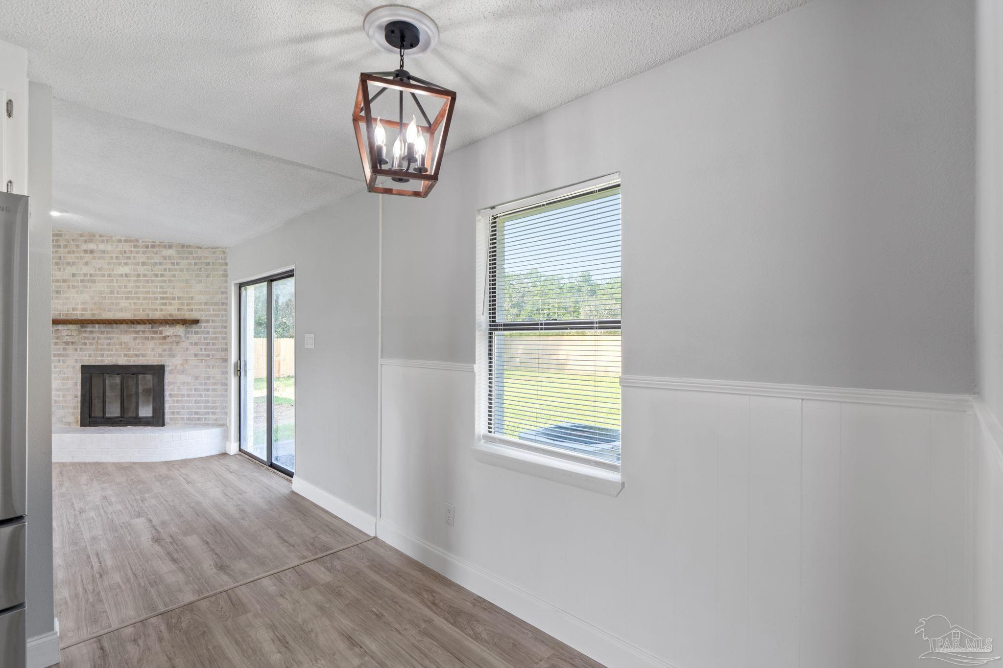 2501 Argle Road Cantonment, FL 32533 - Photo 21 of 36 a view of an empty room with a window and fireplace