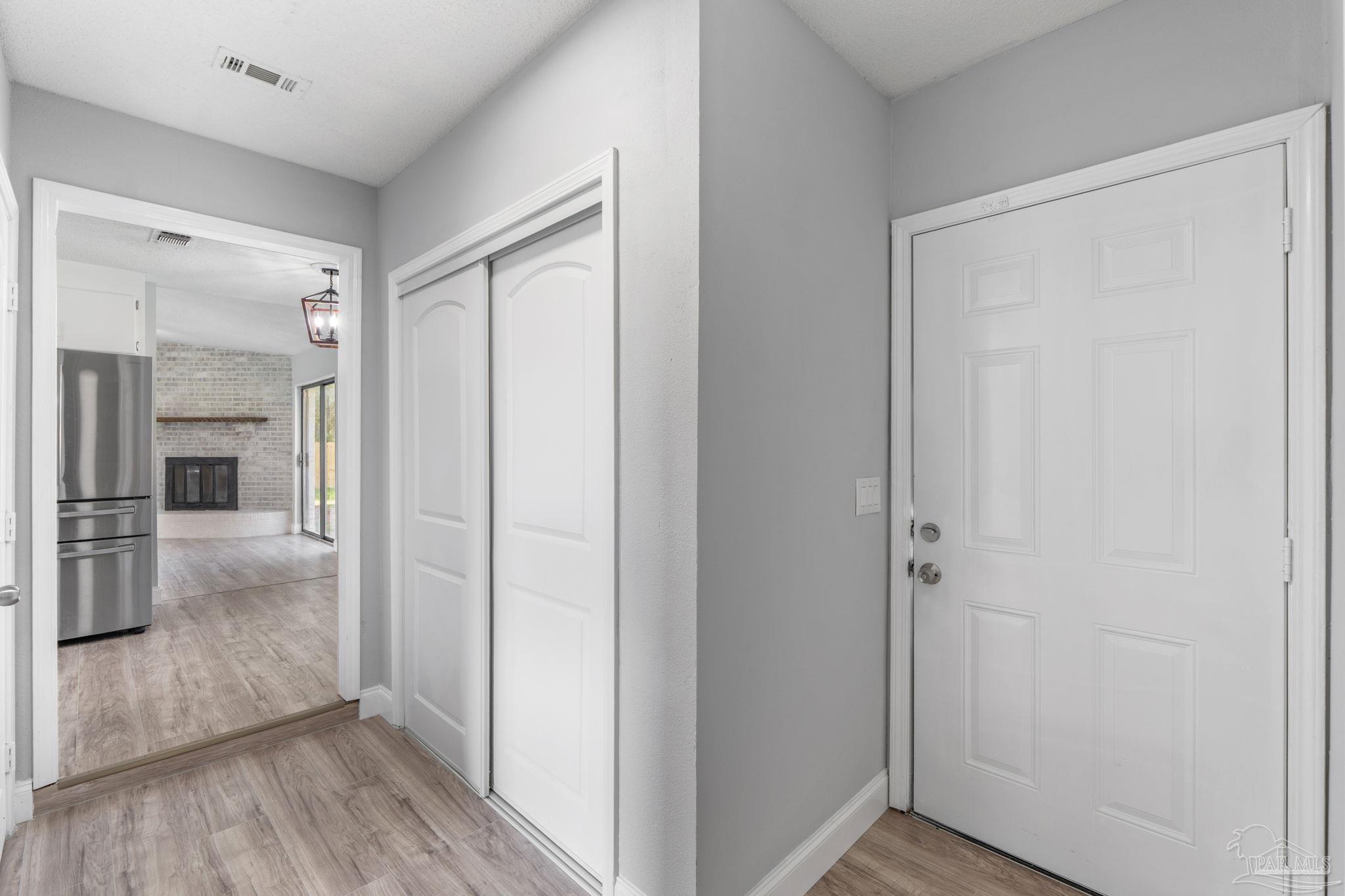 2501 Argle Road Cantonment, FL 32533 - Photo 24 of 36 a view of hallway with livingroom and wooden floor