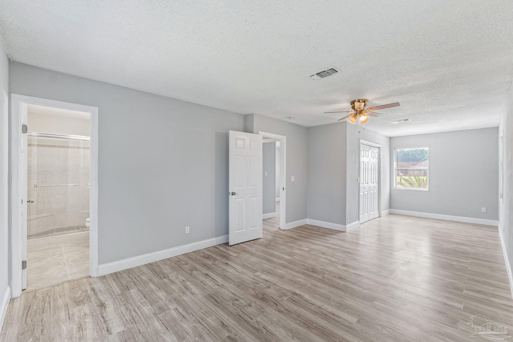 2501 Argle Road Cantonment, FL 32533 - Photo 28 of 36 a view of an empty room with window and wooden floor