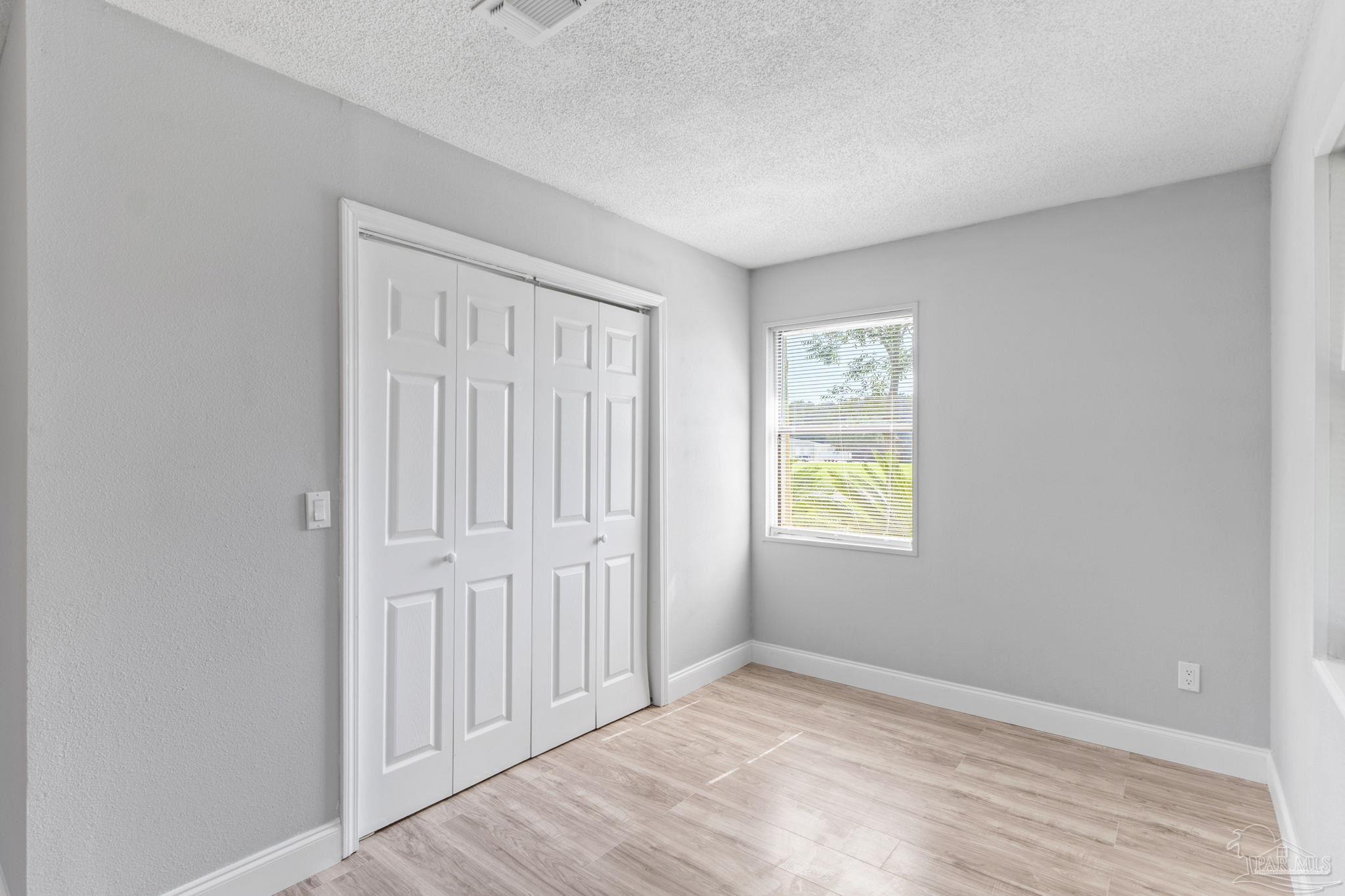 2501 Argle Road Cantonment, FL 32533 - Photo 29 of 36 a view of an empty room with window and closet area