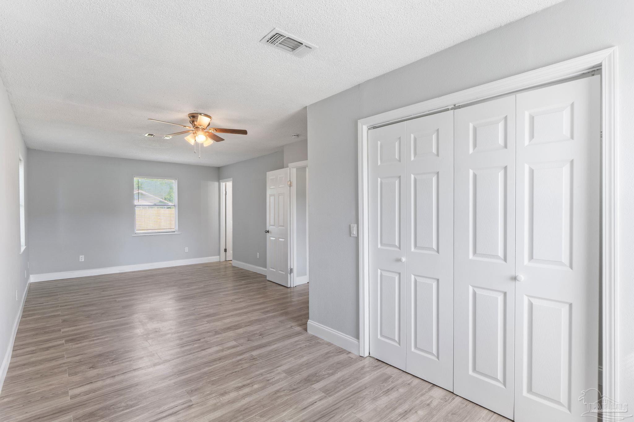 2501 Argle Road Cantonment, FL 32533 - Photo 30 of 36 an empty room with wooden floor and window