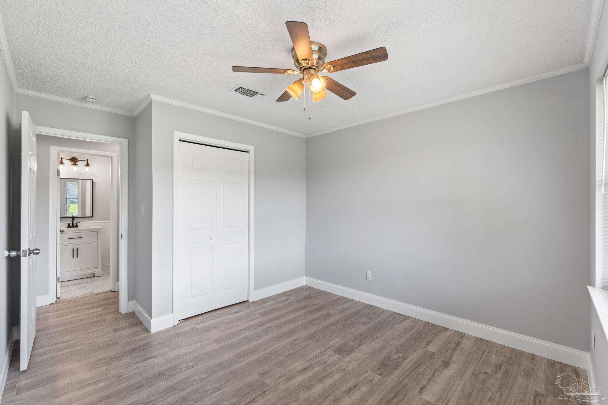 2501 Argle Road Cantonment, FL 32533 - Photo 33 of 36 wooden floor in an empty room with a window