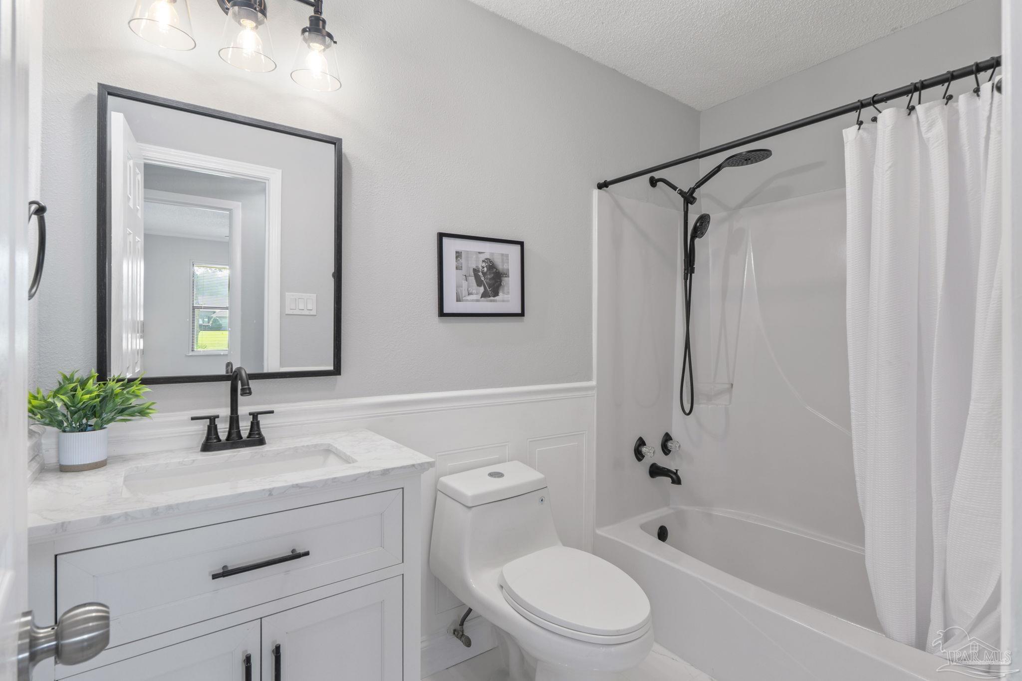 2501 Argle Road Cantonment, FL 32533 - Photo 4 of 36 a bathroom with a sink toilet and shower