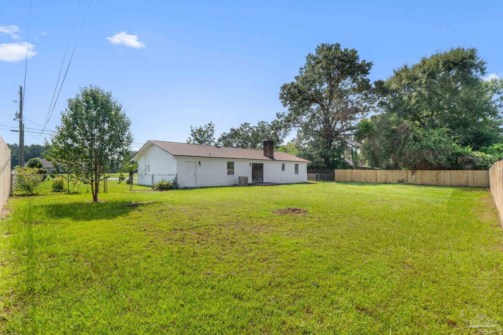 2501 Argle Road Cantonment, FL 32533 - Photo 5 of 36 a front view of a house with a yard