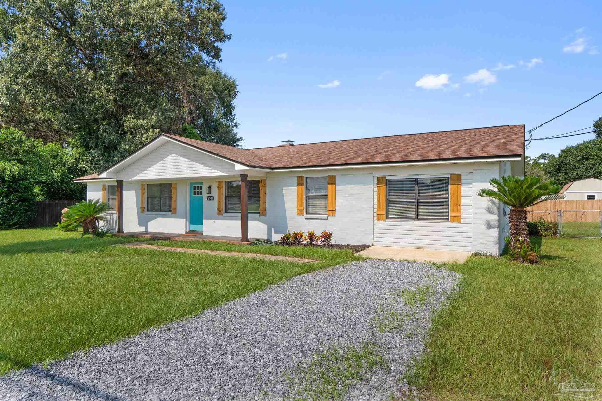 2501 Argle Road Cantonment, FL 32533 - Photo 6 of 36 a front view of a house with a yard and garage