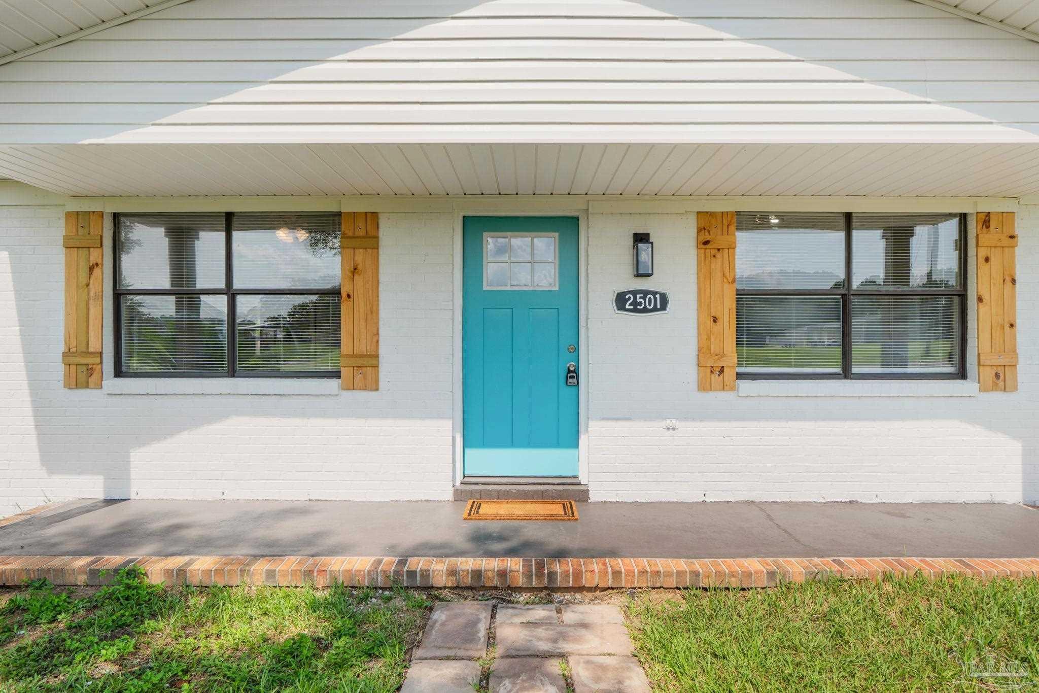 2501 Argle Road Cantonment, FL 32533 - Photo 9 of 36 a front view of a house with a yard
