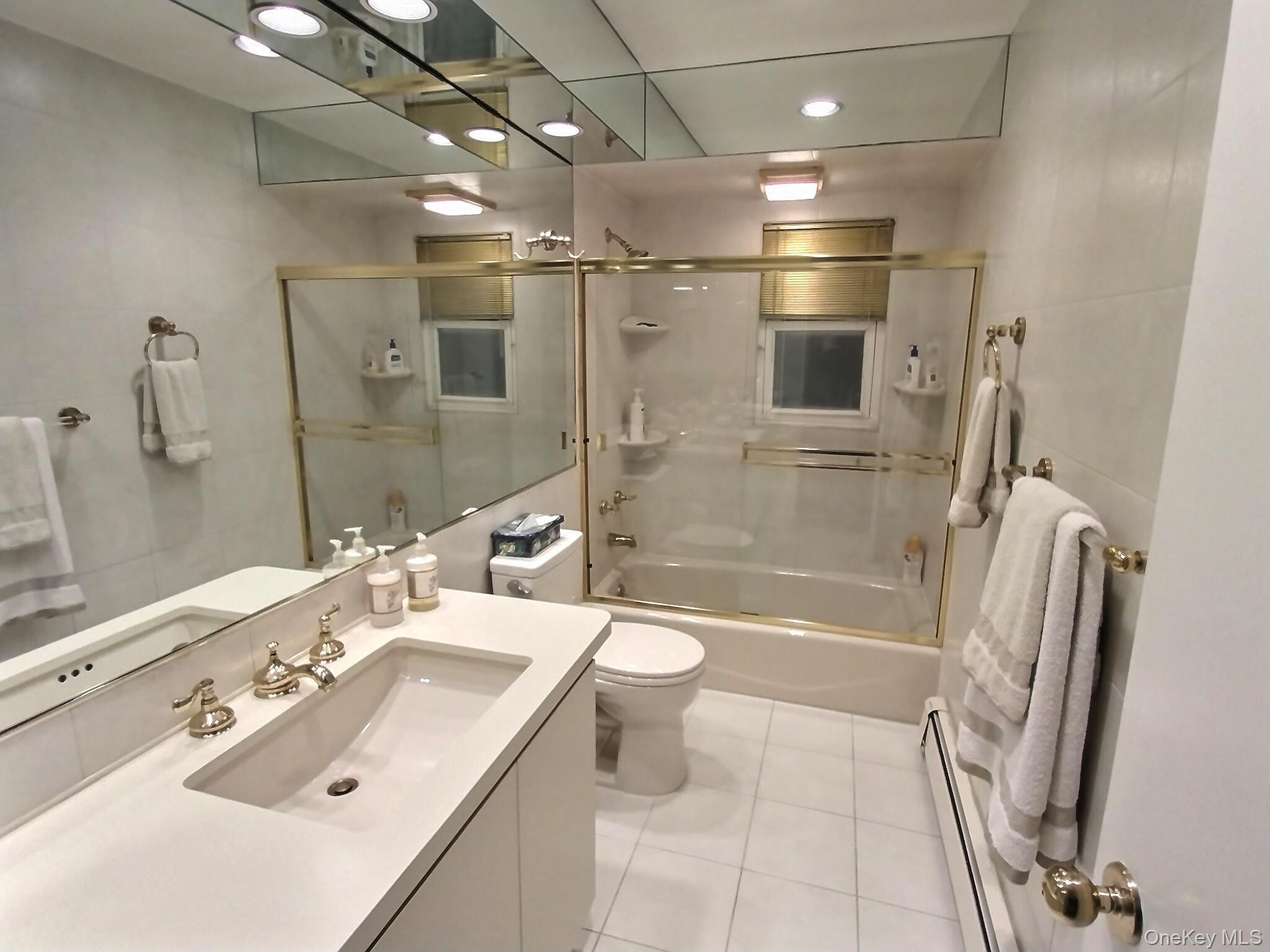 3421 Turf Road Oceanside, NY 11572 - Photo 42 of 50 a bathroom with a sink a toilet and shower