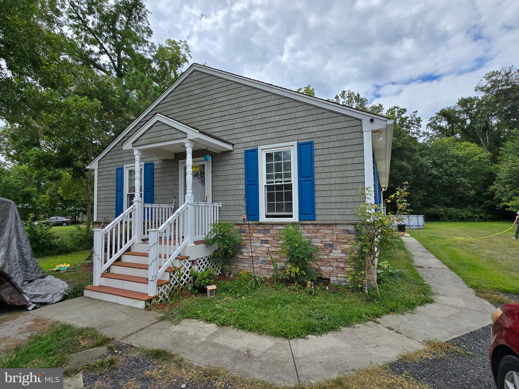 a front view of a house with garden