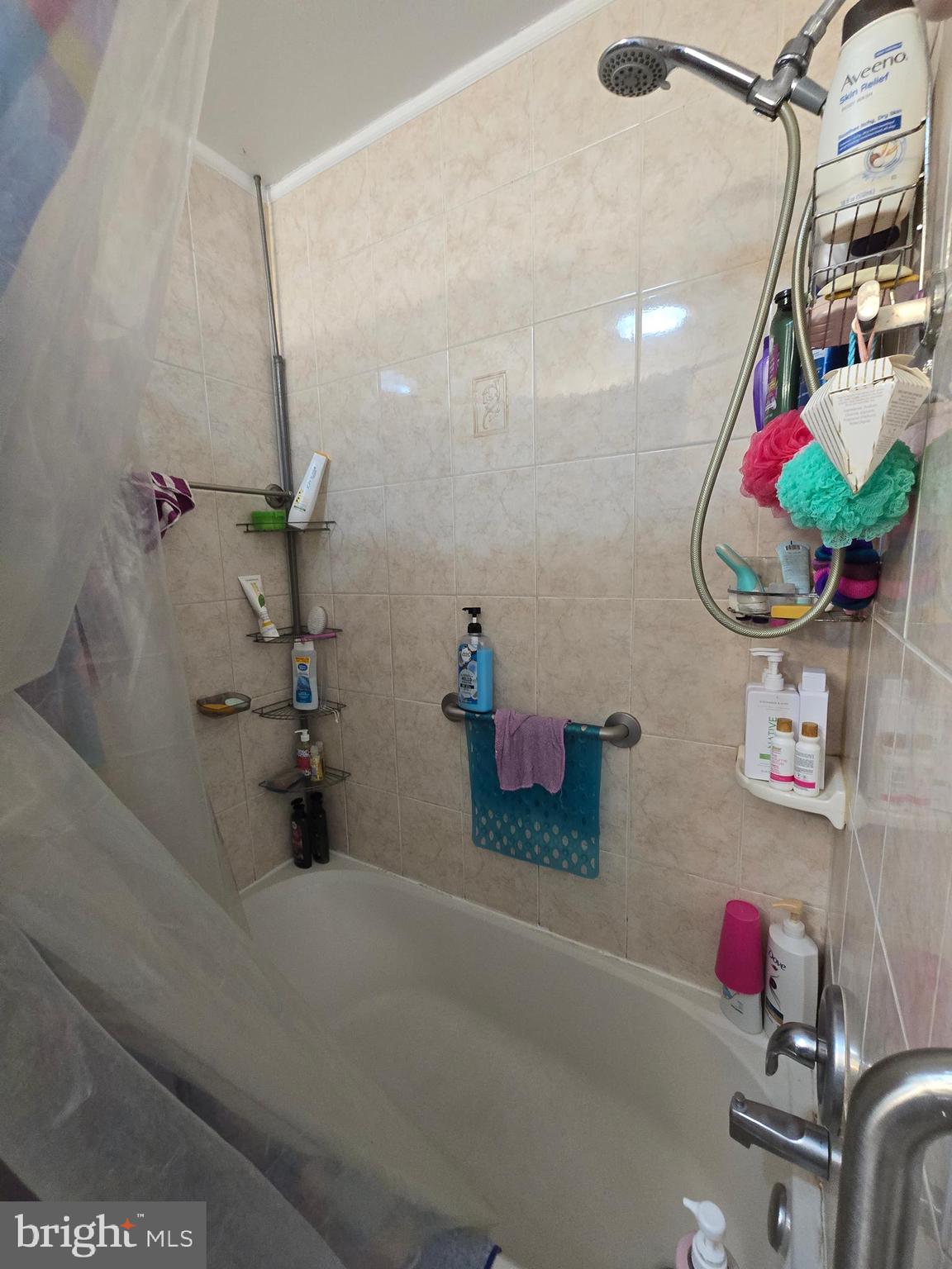 3592 Freedomtown Road Crisfield, MD 21817 - Photo 17 of 22 a bathroom with a tub sink and mirror