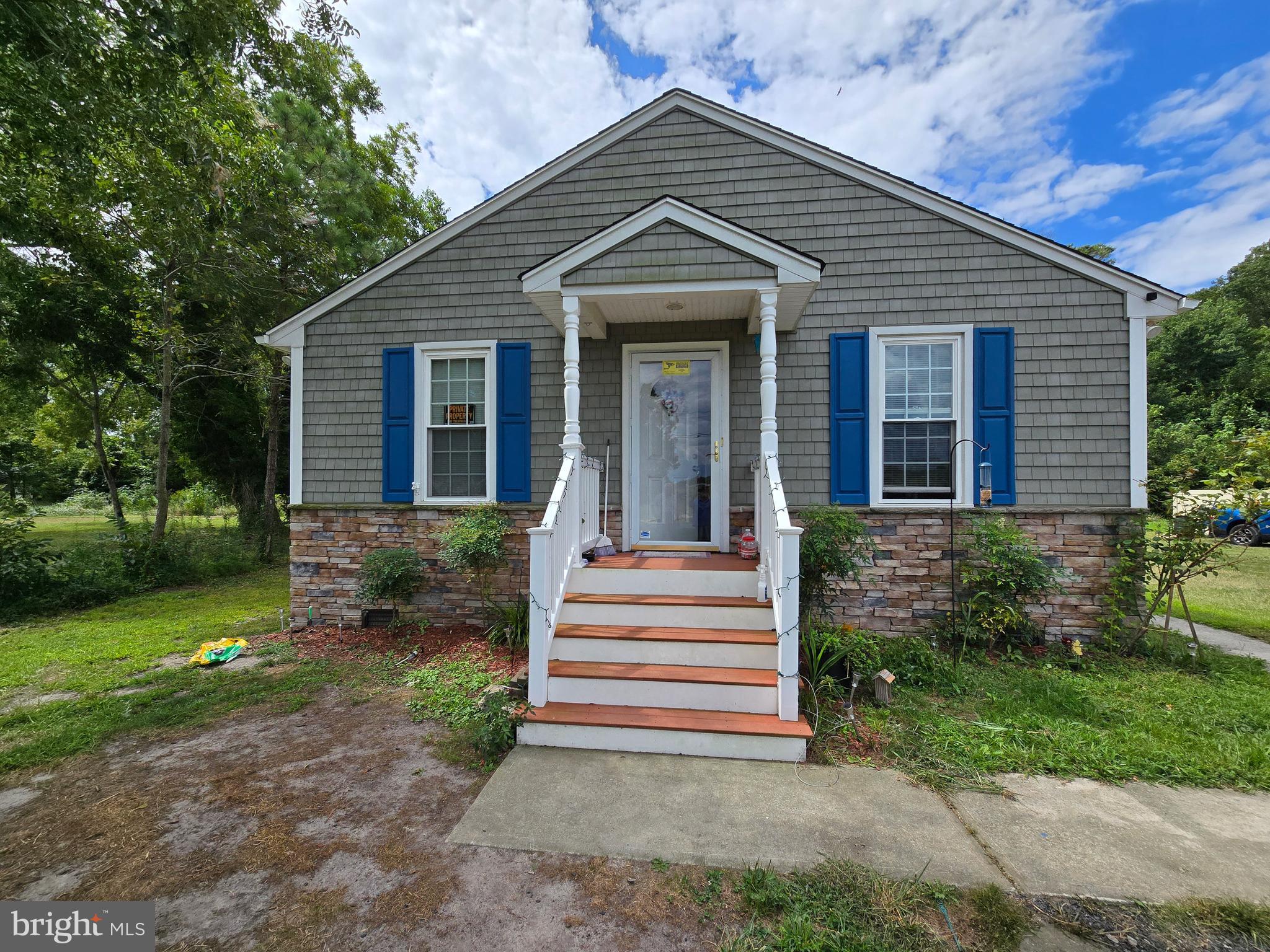 3592 Freedomtown Road Crisfield, MD 21817 - Photo 2 of 22 a front view of a house with a yard