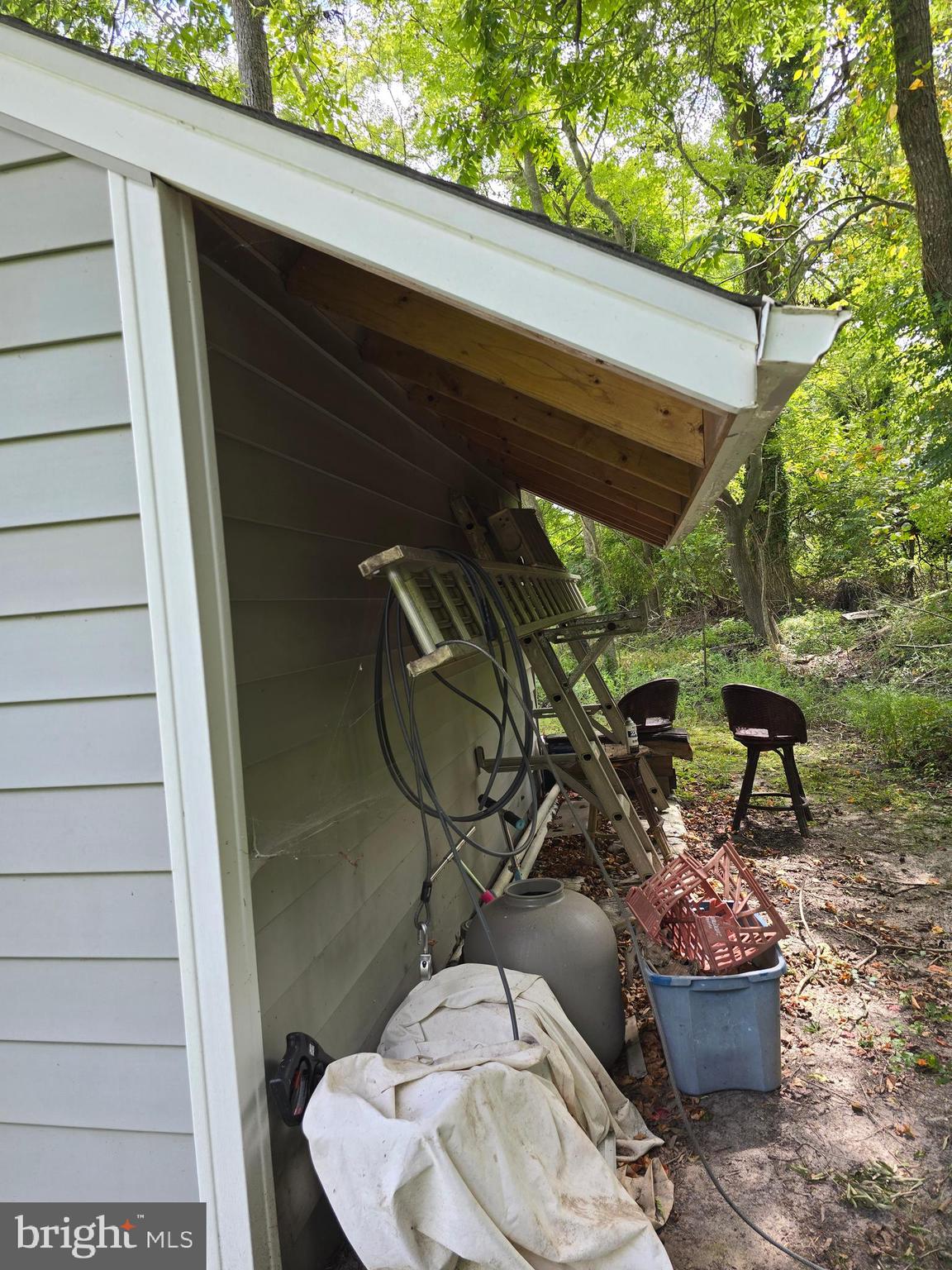 3592 Freedomtown Road Crisfield, MD 21817 - Photo 21 of 22 a backyard of a house with table and chairs