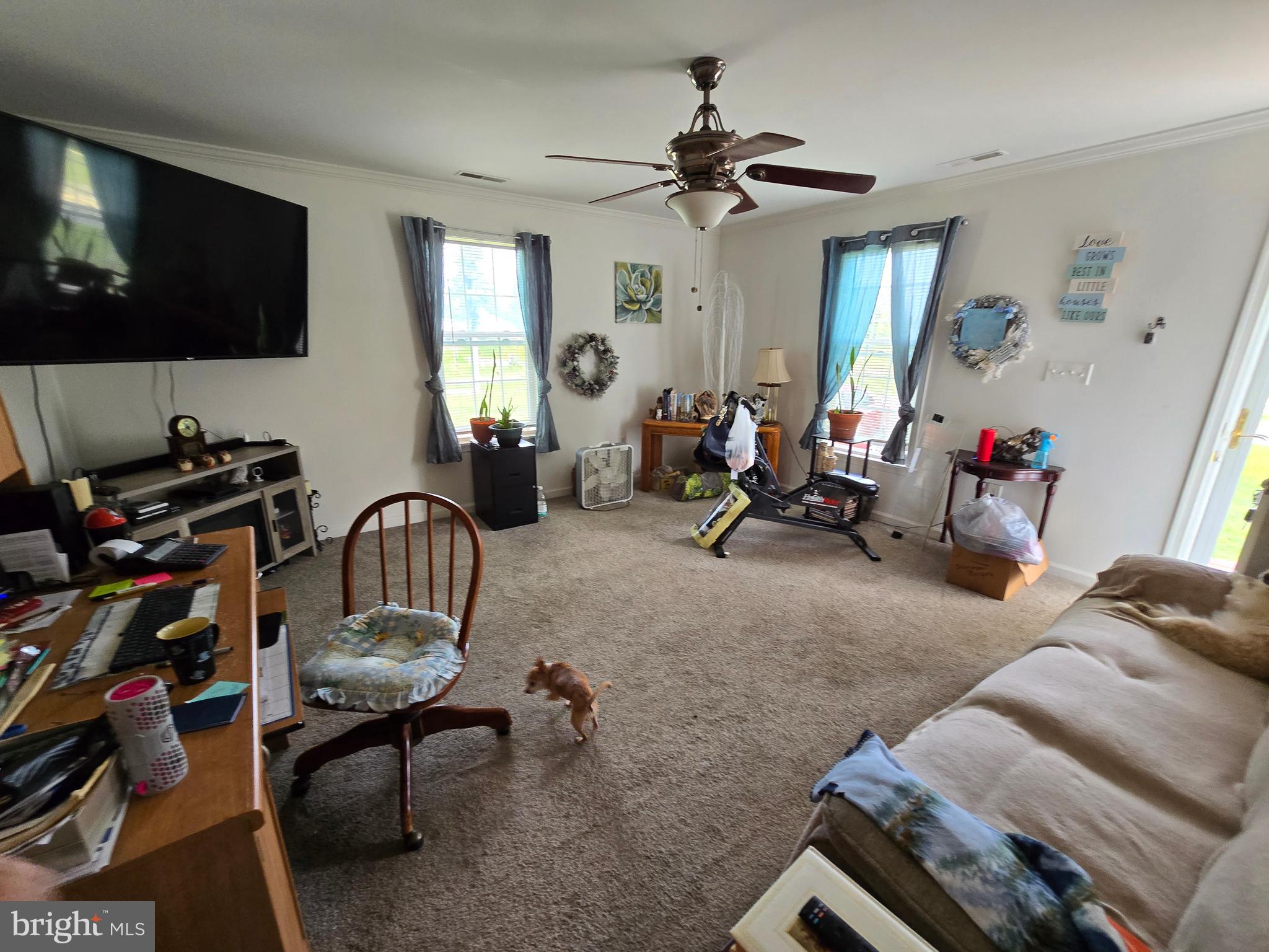 3592 Freedomtown Road Crisfield, MD 21817 - Photo 8 of 22 a view of a livingroom with furniture and a flat screen tv