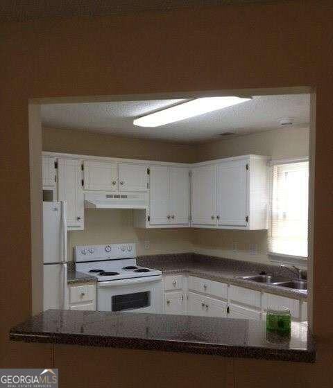 132 Warren Way Athens, GA 30605 - Photo 6 of 13 a kitchen with stainless steel appliances granite countertop a stove and a granite counter tops