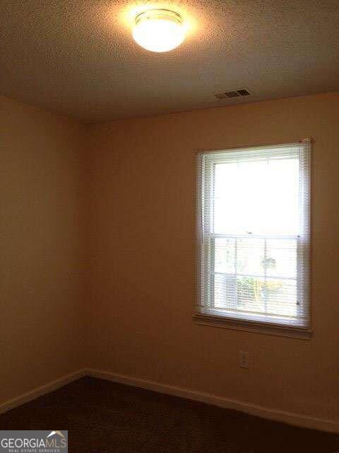 132 Warren Way Athens, GA 30605 - Photo 8 of 13 an empty room with a window