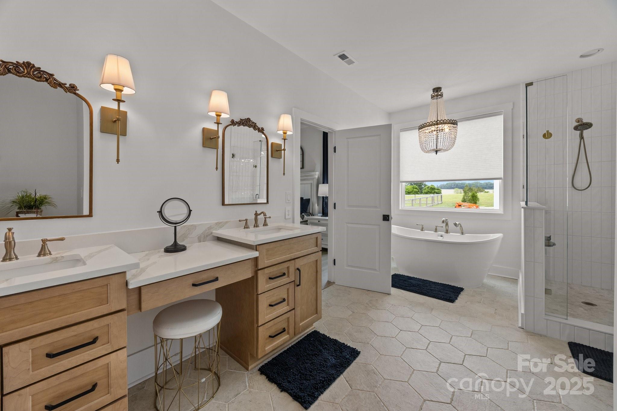 4316 Nesbit Road Monroe, NC 28112 - Photo 16 of 33 a spacious bathroom with a granite countertop sink mirror and a bathtub