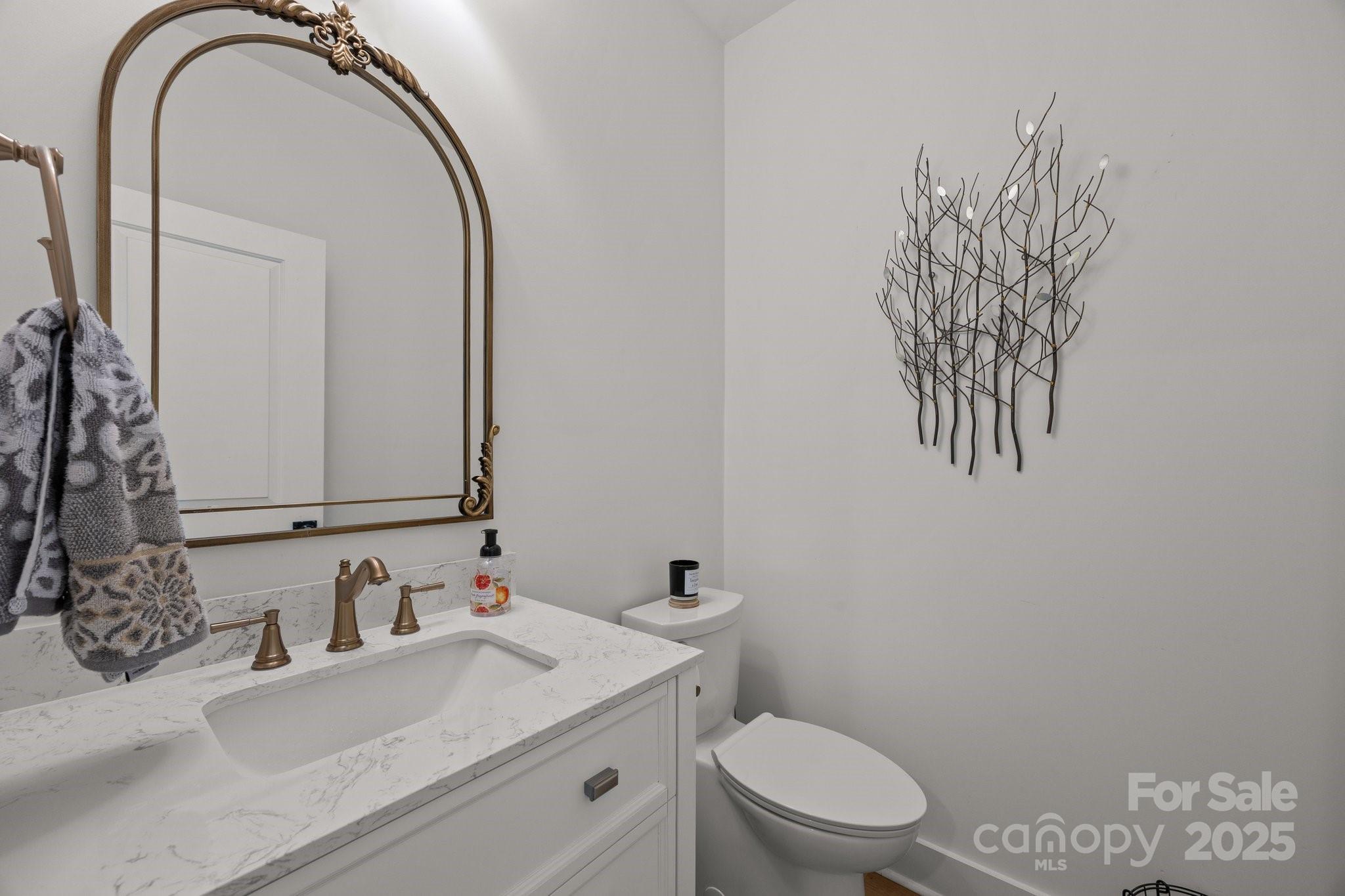 4316 Nesbit Road Monroe, NC 28112 - Photo 23 of 33 a bathroom with a sink vanity mirror and toilet