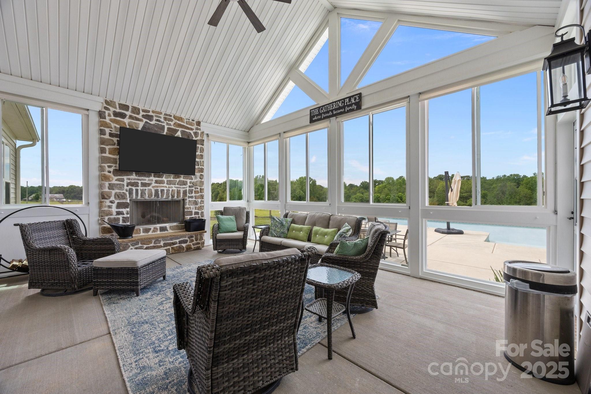 4316 Nesbit Road Monroe, NC 28112 - Photo 25 of 33 a living room with furniture a fireplace and a flat screen tv