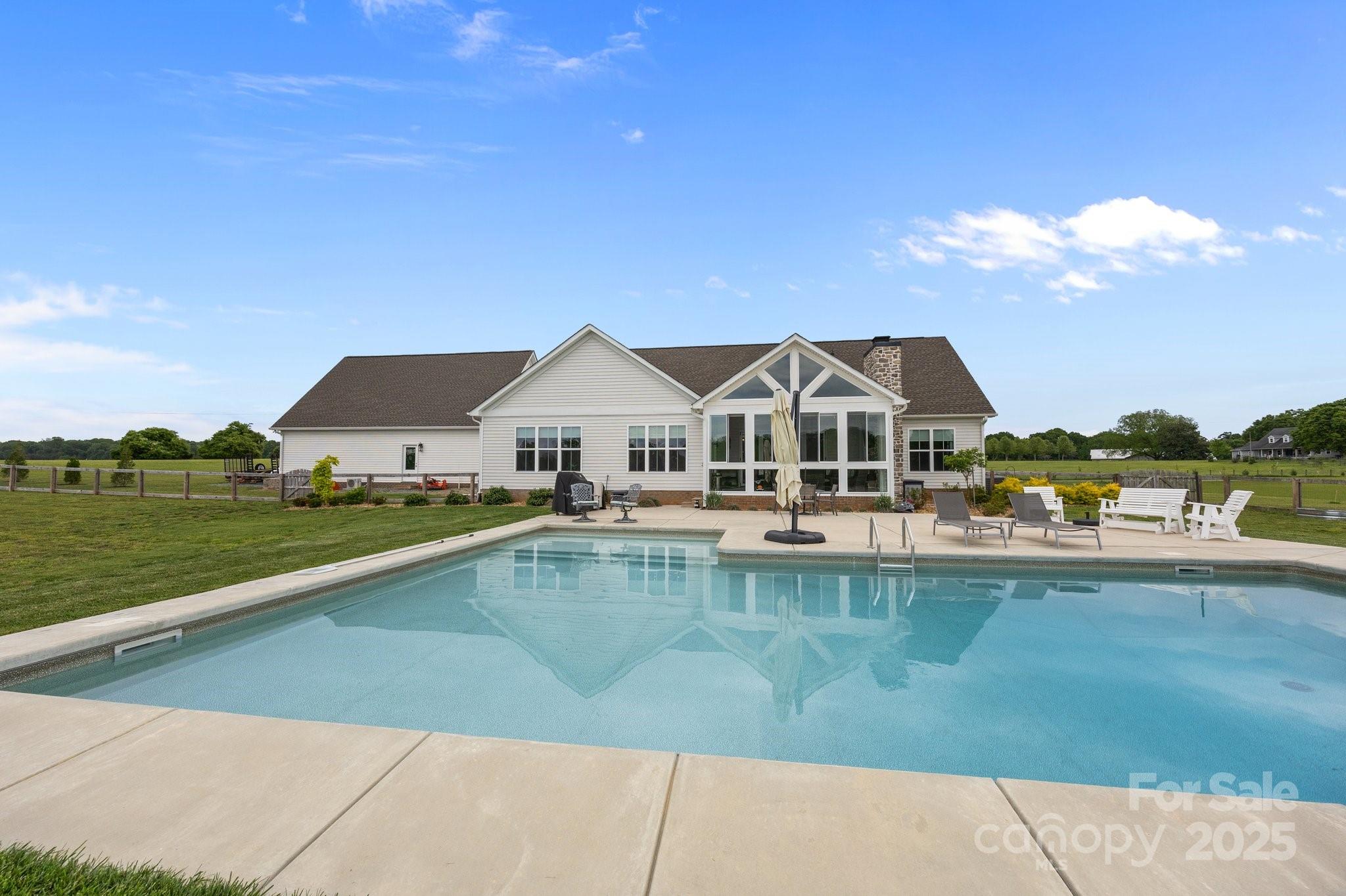 4316 Nesbit Road Monroe, NC 28112 - Photo 29 of 33 a aerial view of a house with swimming pool and a yard