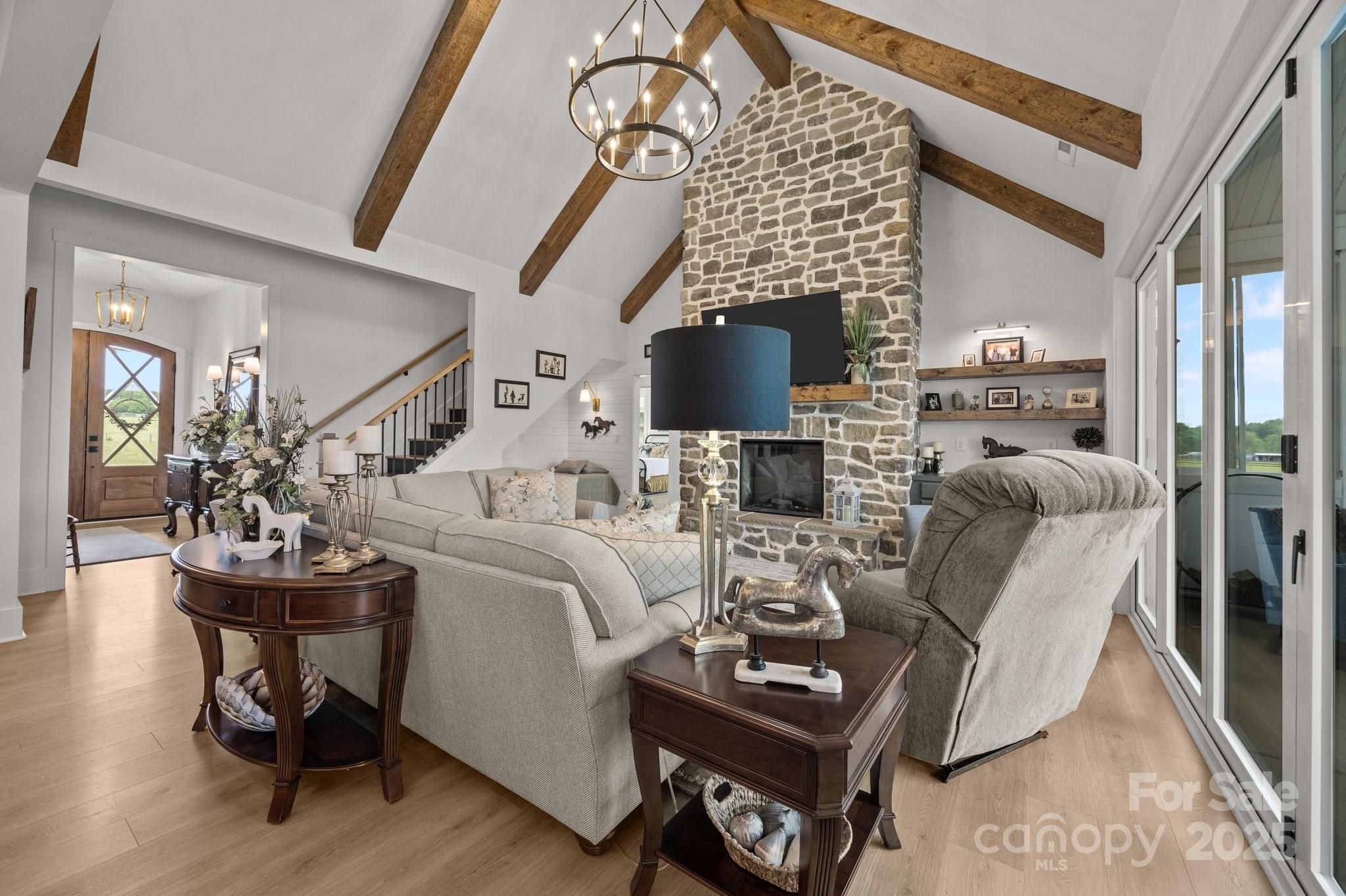 4316 Nesbit Road Monroe, NC 28112 - Photo 5 of 33 a living room with furniture a flat screen tv and a fireplace