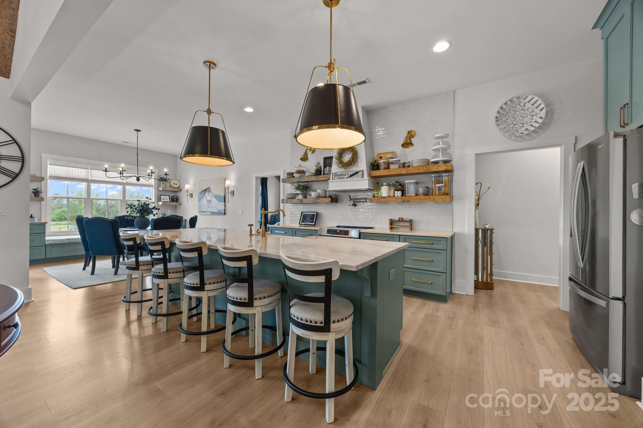 4316 Nesbit Road Monroe, NC 28112 - Photo 7 of 33 a kitchen with stainless steel appliances granite countertop a sink a stove and a refrigerator