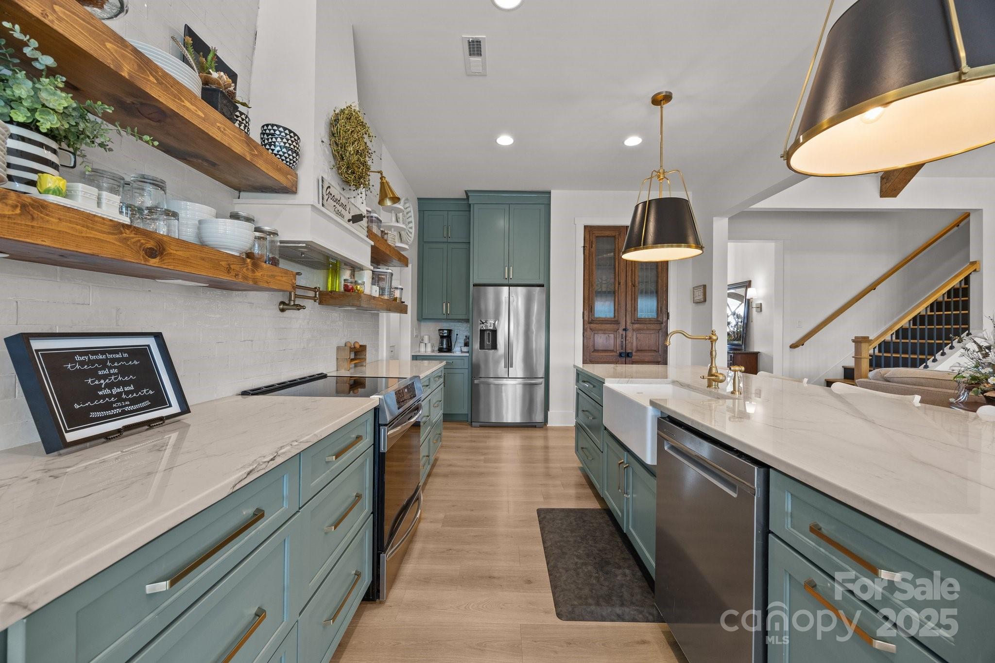 4316 Nesbit Road Monroe, NC 28112 - Photo 9 of 33 a large kitchen with stainless steel appliances kitchen island a large counter top