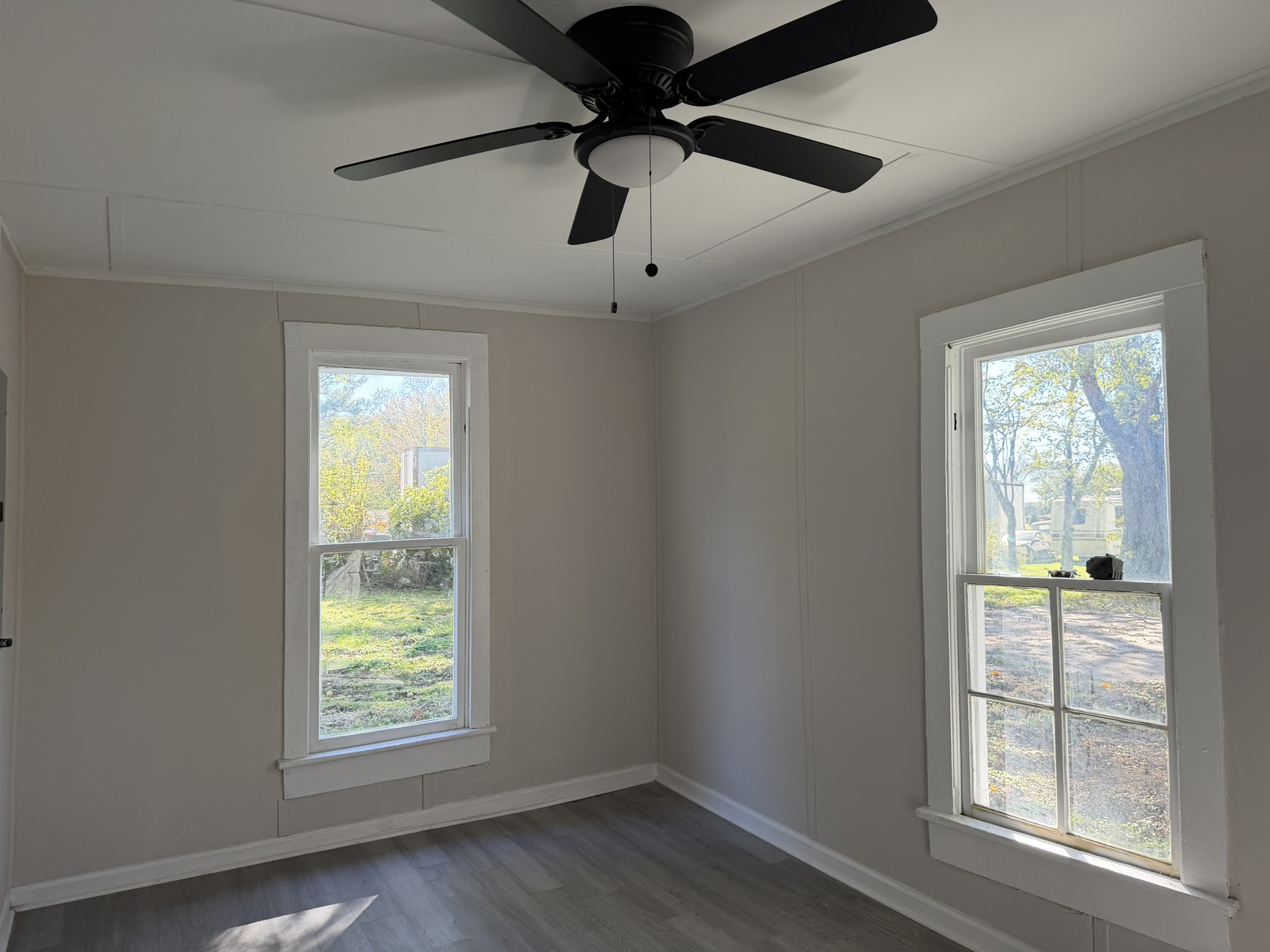 481 Elora Road Elora, TN 37328 - Photo 6 of 13 an empty room with windows and ceiling fan