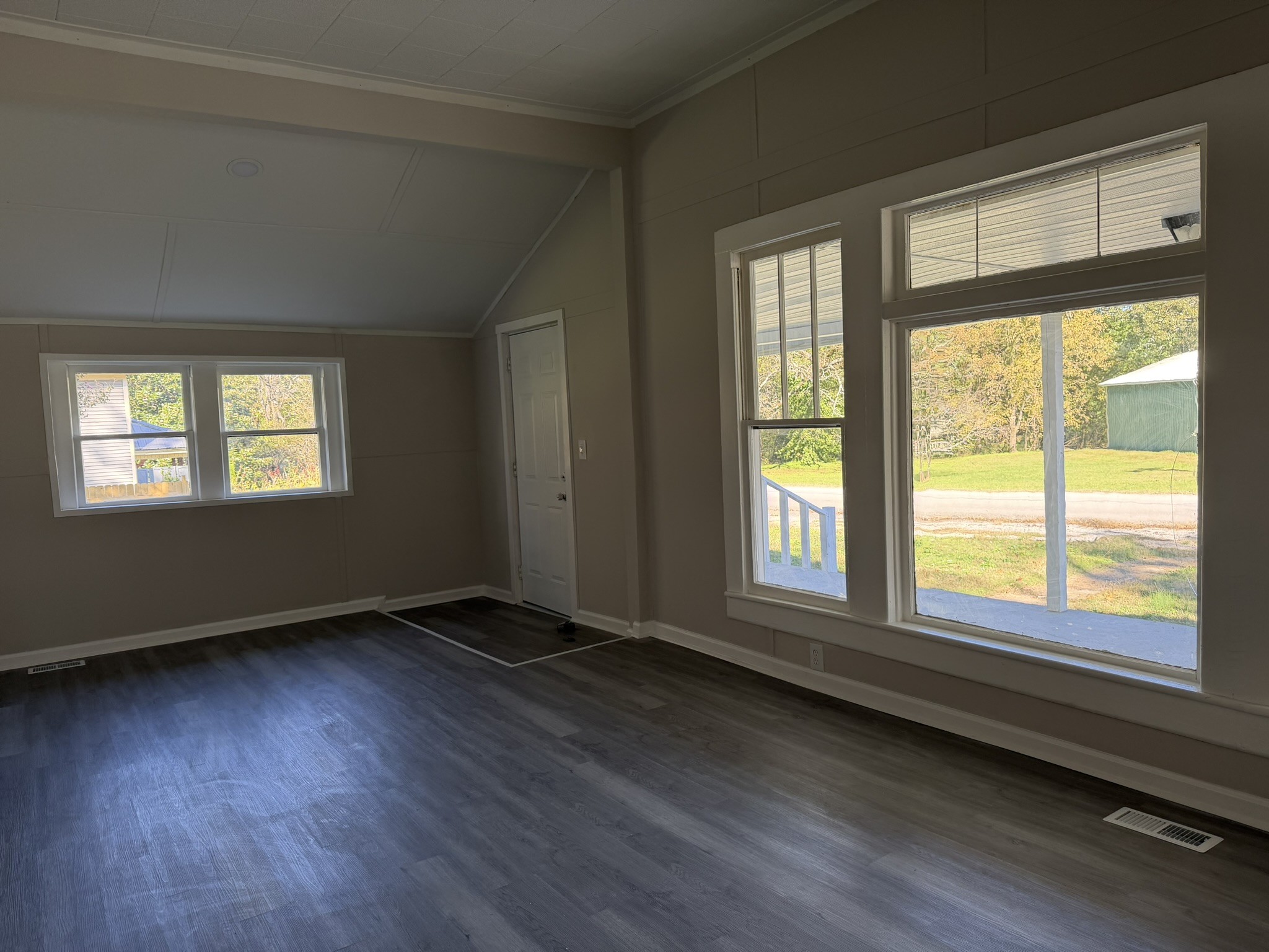 481 Elora Road Elora, TN 37328 - Photo 10 of 13 a view of an empty room with wooden floor and a window