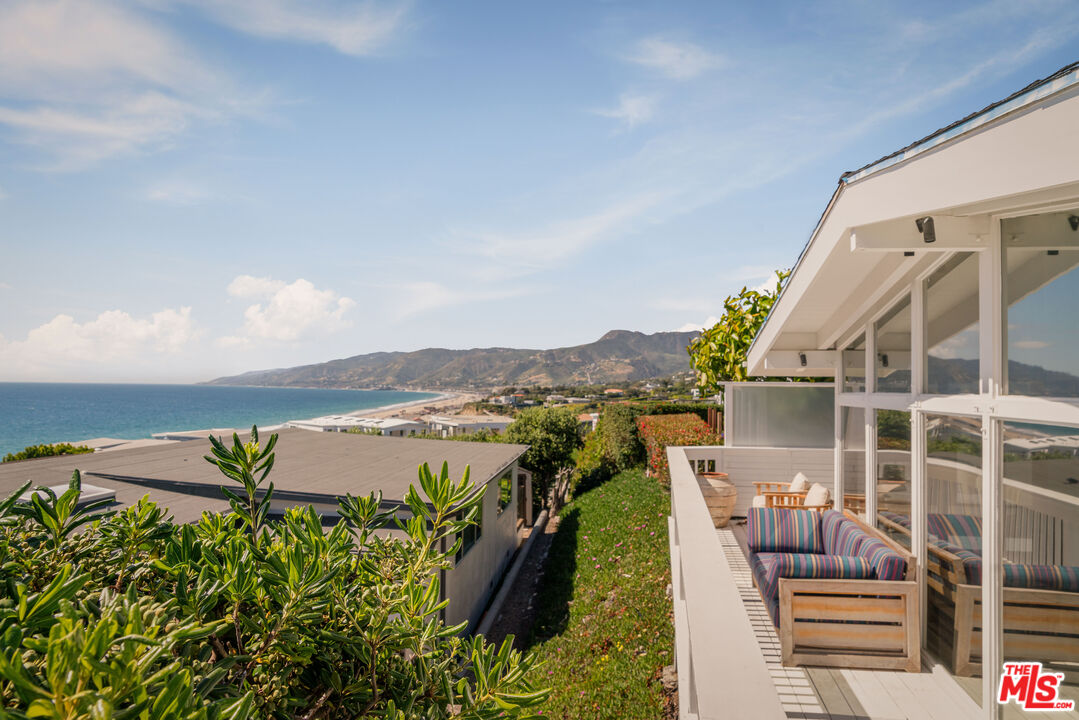 29500 Heathercliff Road, Unit 138 Malibu, CA 90265 - Photo 15 of 20 a view of swimming pool with outdoor seating and city view